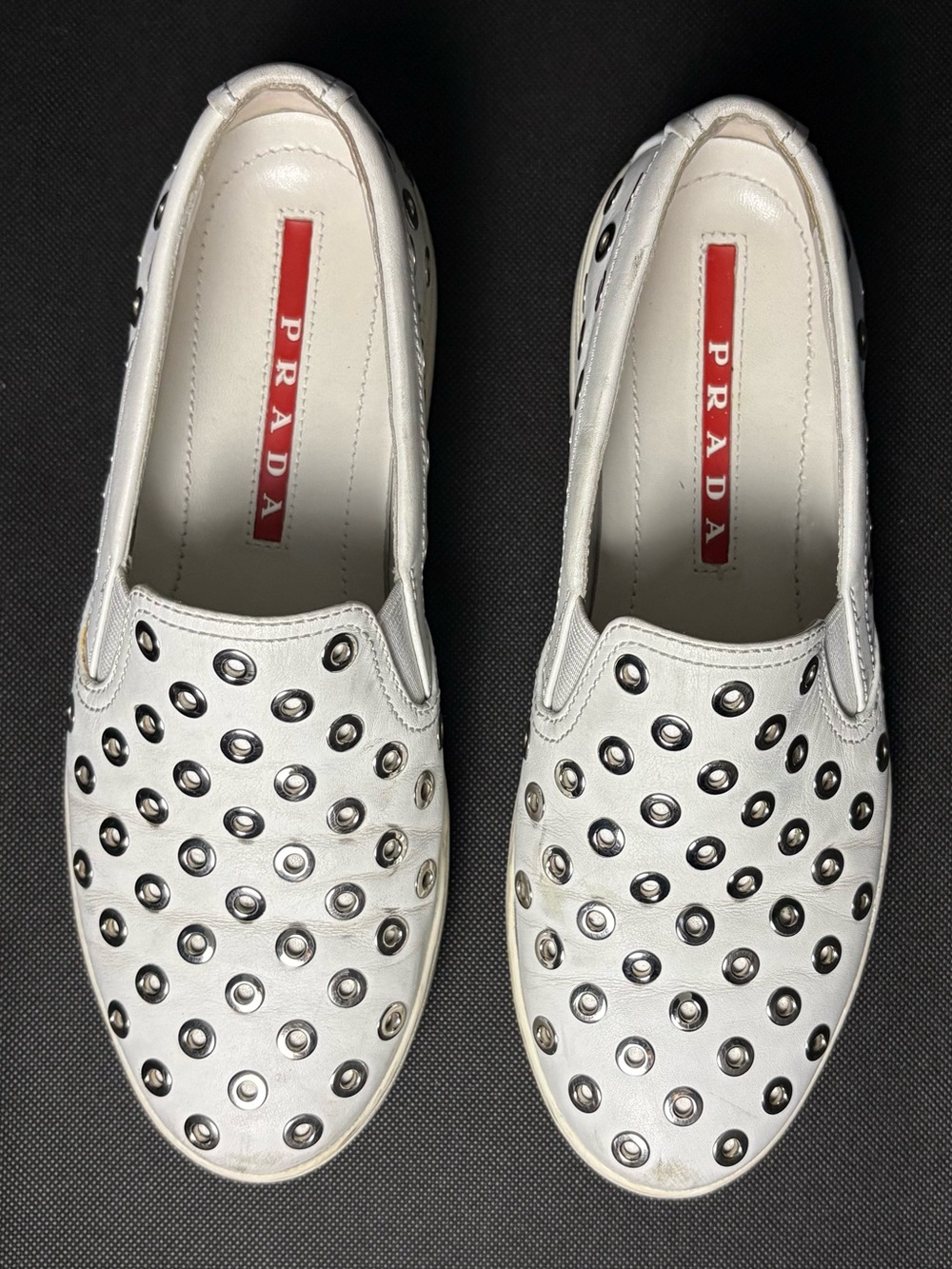 Prada White Leather Studded Silver Grommet Slip-On Sneakers US 6.5 (EU 37)